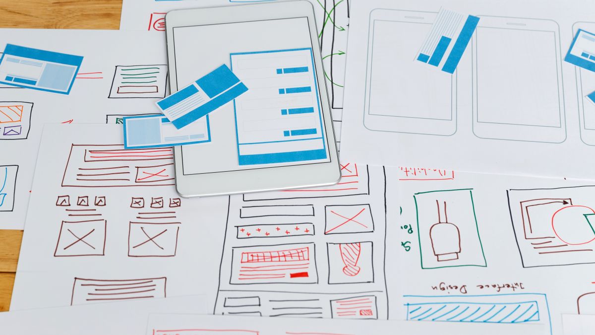 Top view of Creative flat lay UX designer working space and office supplies. © scarie / Adobe Stock